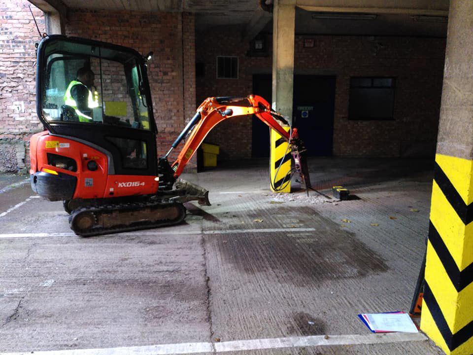 Mini digger with pneumatic drill